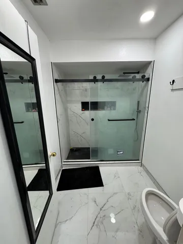 a bathroom with a sink and mirror