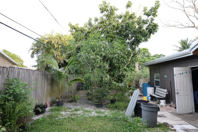 a backyard of a house with lots of green space