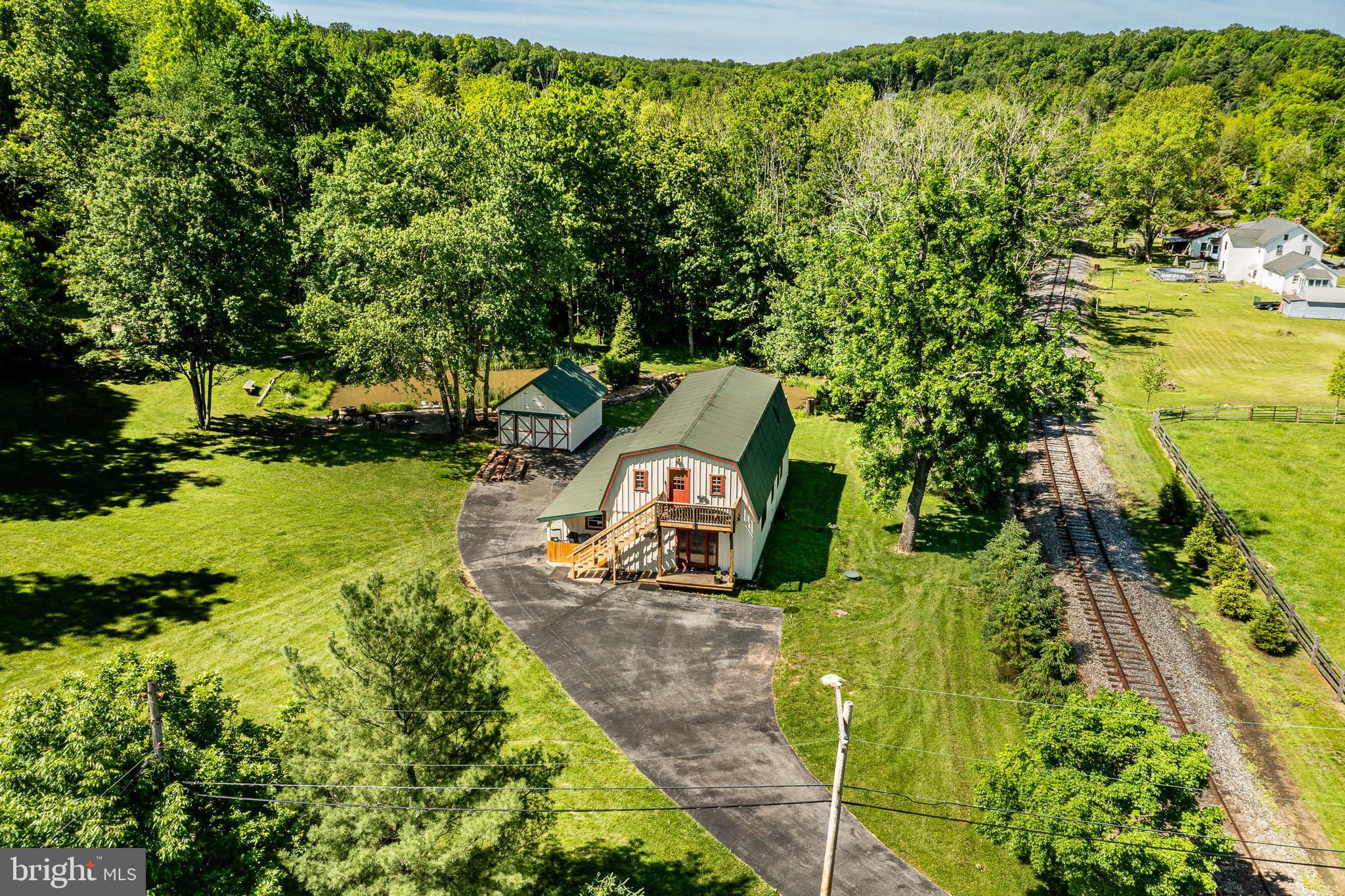 186 Bragg Hill Road West Chester, PA 19382 - Photo 50 of 73 an aerial view of a house with a yard basket ball court and outdoor seating