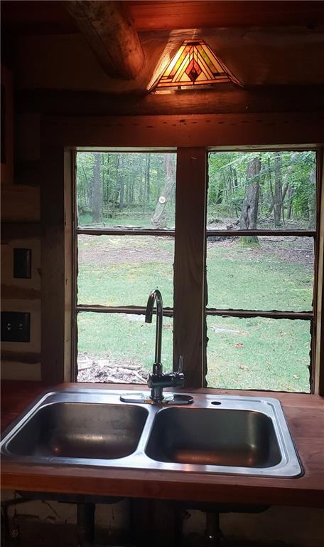 328 Wilkins Road Rector, PA 15677 - Photo 11 of 19 a view of a sink sitting next to a window