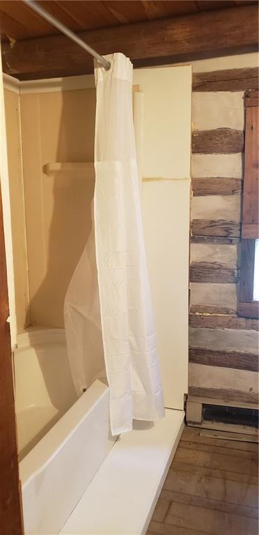 328 Wilkins Road Rector, PA 15677 - Photo 14 of 19 a bathroom with a bathtub and a shower