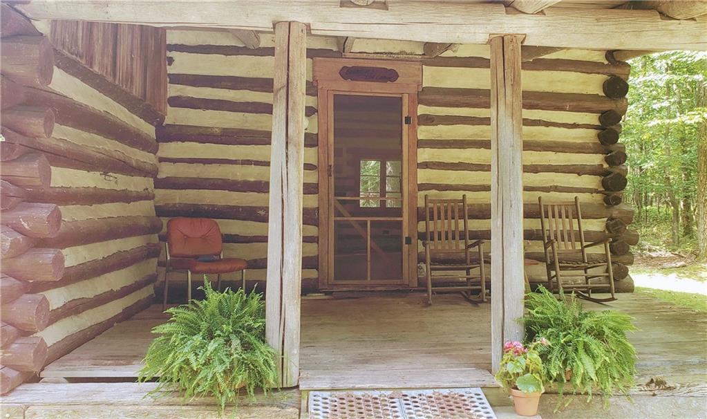 328 Wilkins Road Rector, PA 15677 - Photo 2 of 19 a view of a house with a potted plant and a window