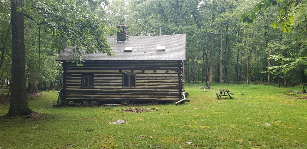 328 Wilkins Road Rector, PA 15677 - Photo 6 of 19 a view of a bench in the garden