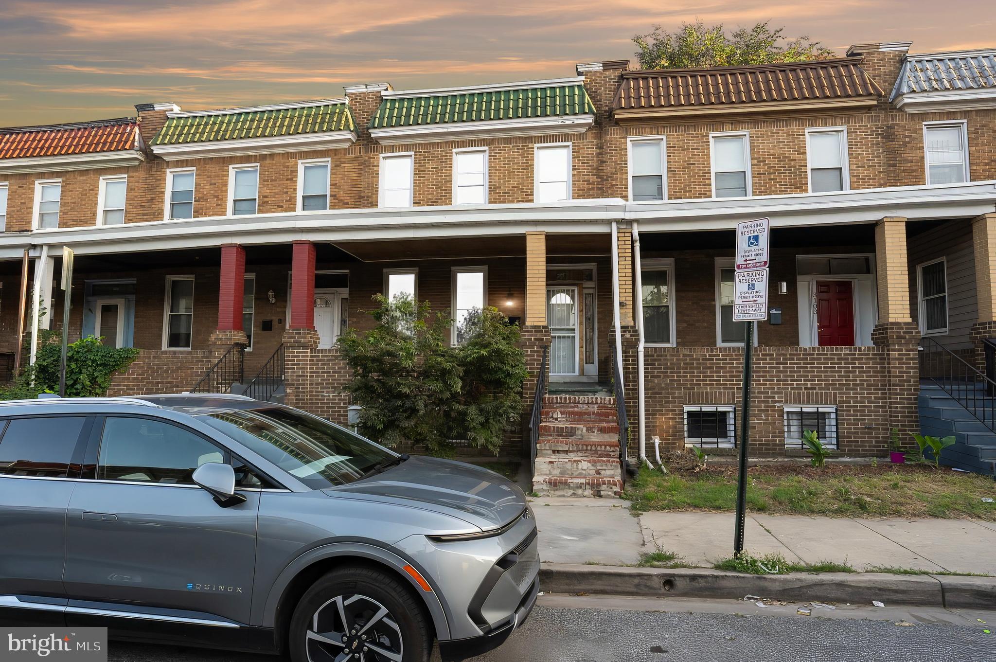 3105 Mareco Avenue Baltimore, MD 21213 - Photo 1 of 27 a front view of residential houses with street