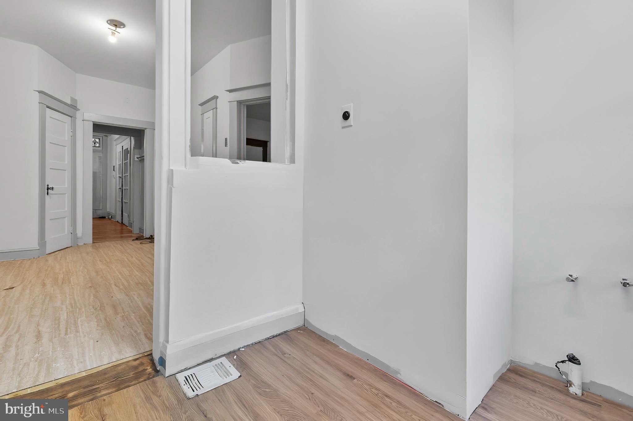 3105 Mareco Avenue Baltimore, MD 21213 - Photo 11 of 27 a view of a hallway with wooden floor and closet