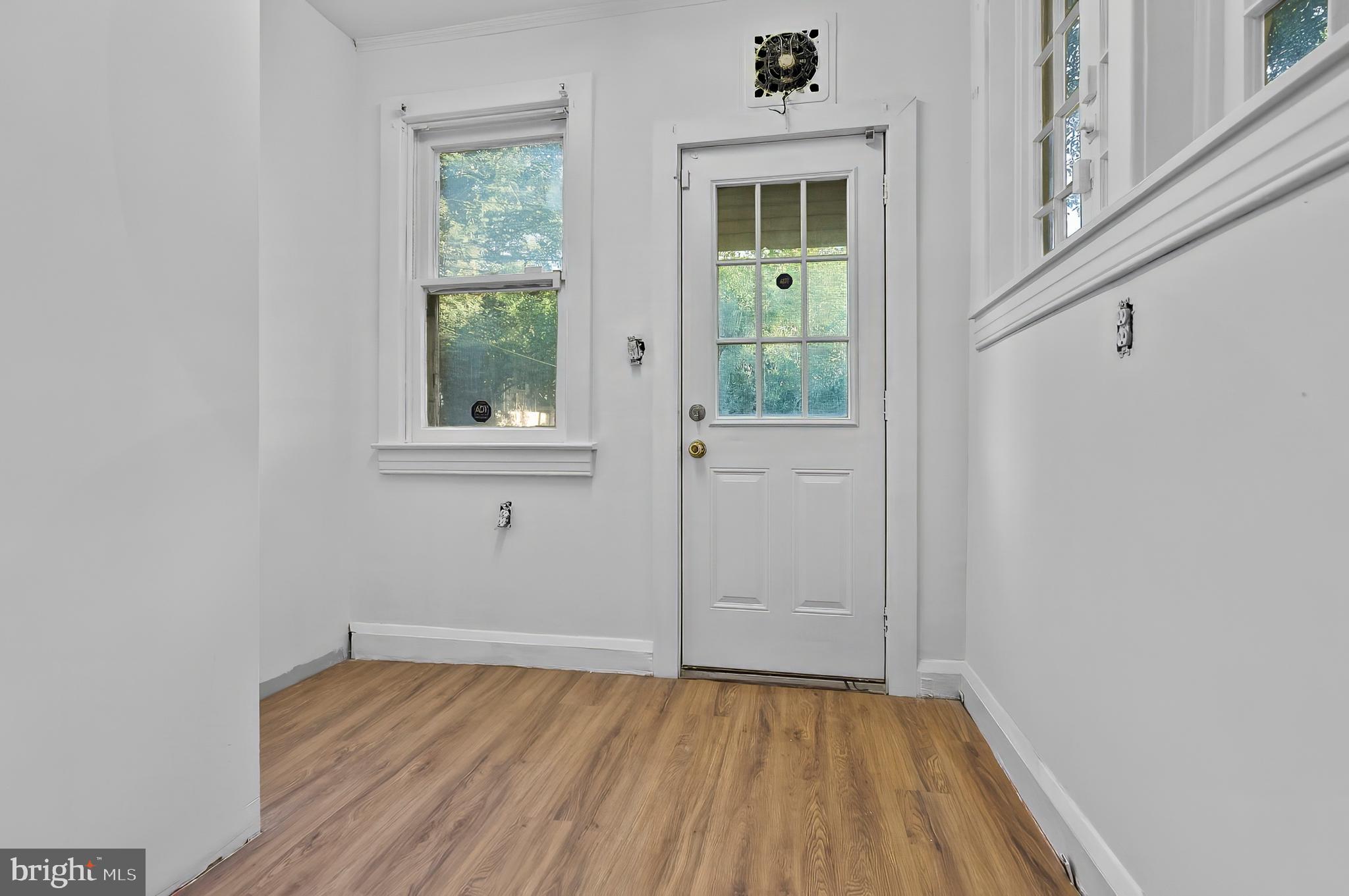 3105 Mareco Avenue Baltimore, MD 21213 - Photo 12 of 27 a view of an empty room with wooden floor and a window