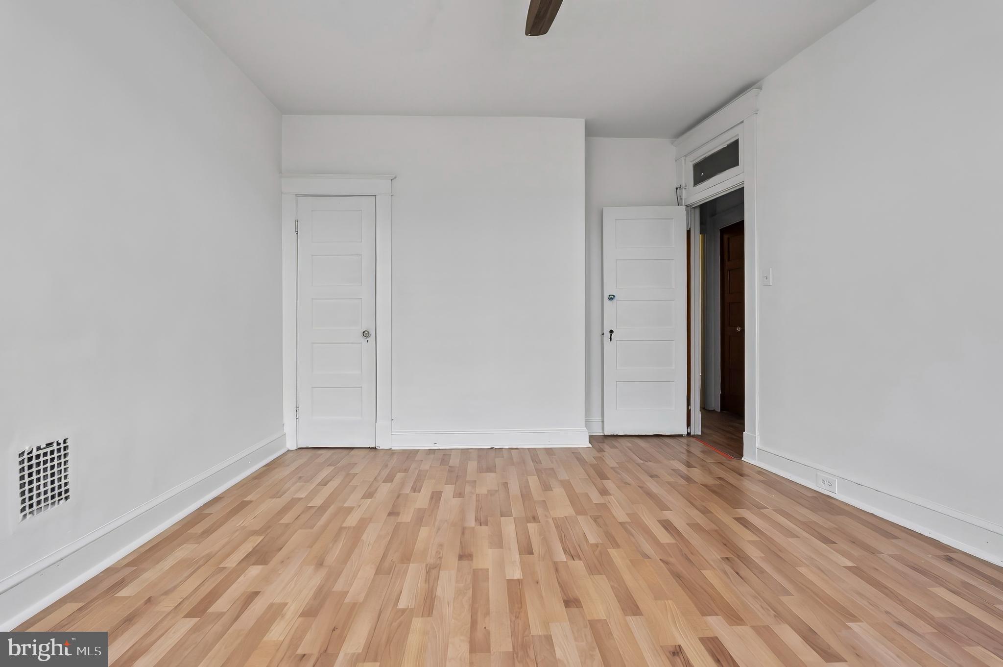 3105 Mareco Avenue Baltimore, MD 21213 - Photo 15 of 27 a view of an empty room with wooden floor