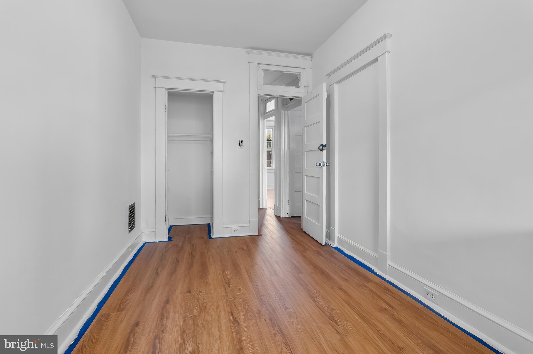 3105 Mareco Avenue Baltimore, MD 21213 - Photo 19 of 27 a view of a hallway with wooden floor and closet