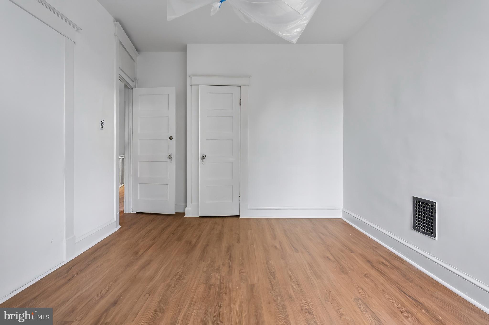 3105 Mareco Avenue Baltimore, MD 21213 - Photo 21 of 27 a view of an empty room with wooden floor