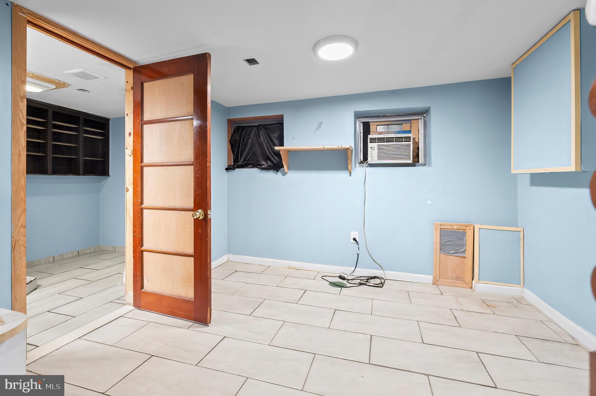 3105 Mareco Avenue Baltimore, MD 21213 - Photo 25 of 27 a very nice looking room with a large window