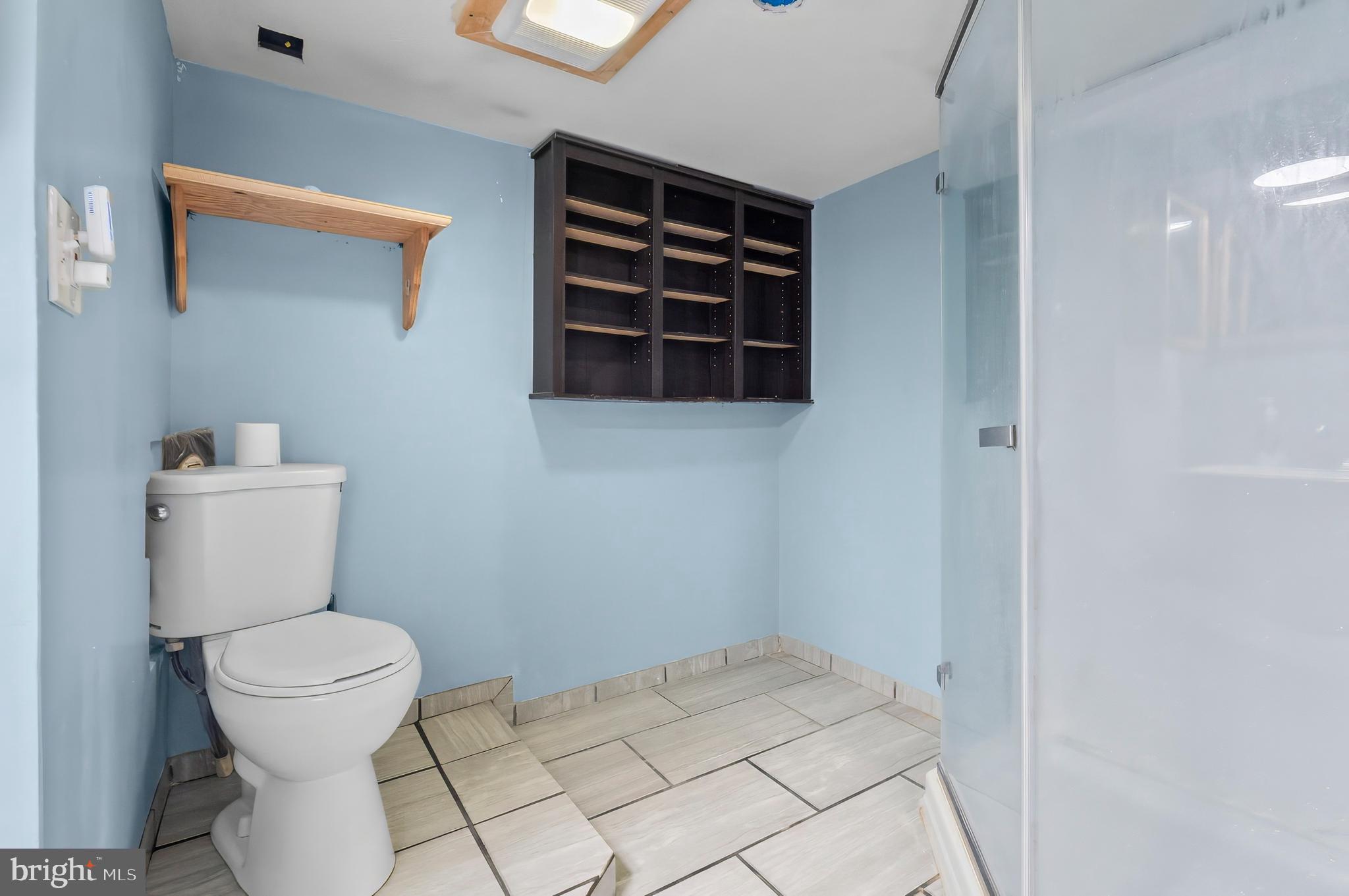 3105 Mareco Avenue Baltimore, MD 21213 - Photo 27 of 27 a bathroom with a toilet and a shower