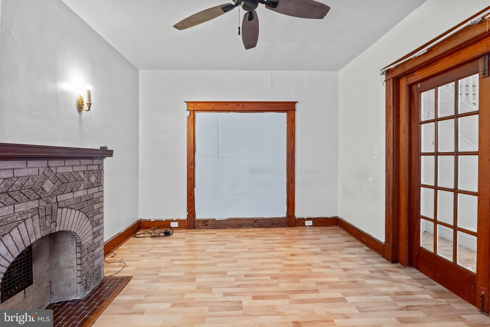 3105 Mareco Avenue Baltimore, MD 21213 - Photo 5 of 27 a view of empty room with stairs and wooden floor