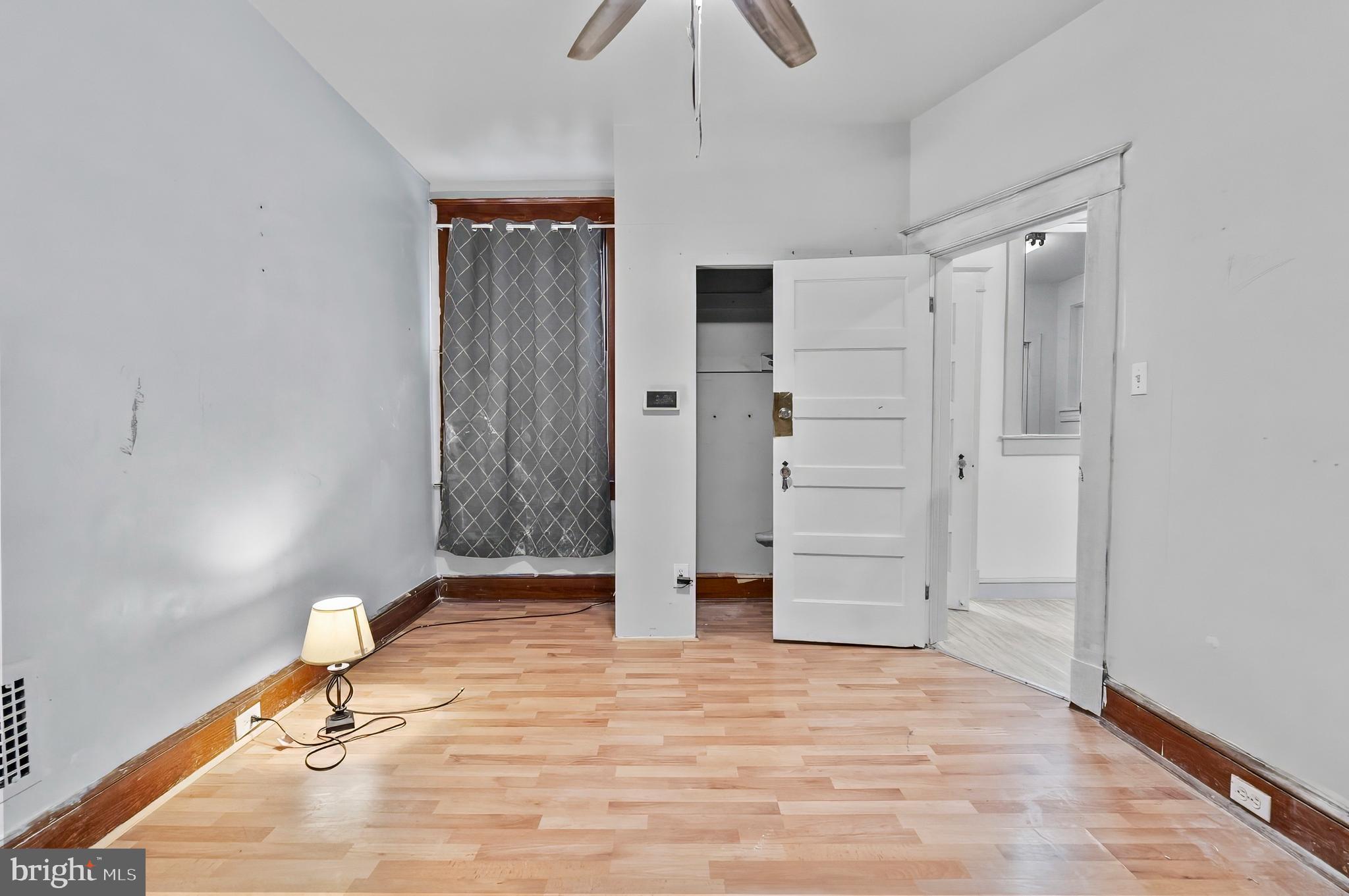 3105 Mareco Avenue Baltimore, MD 21213 - Photo 7 of 27 a view of a room with wooden floor and white walls