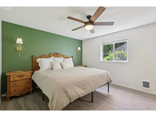 a bedroom with a bed and a window