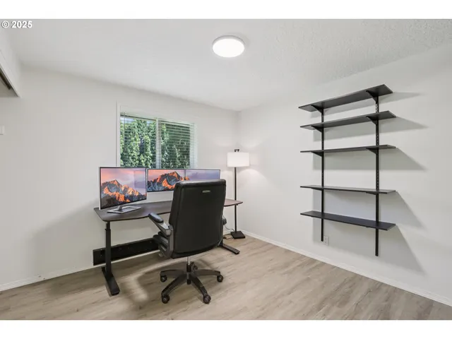 a workspace with furniture and window