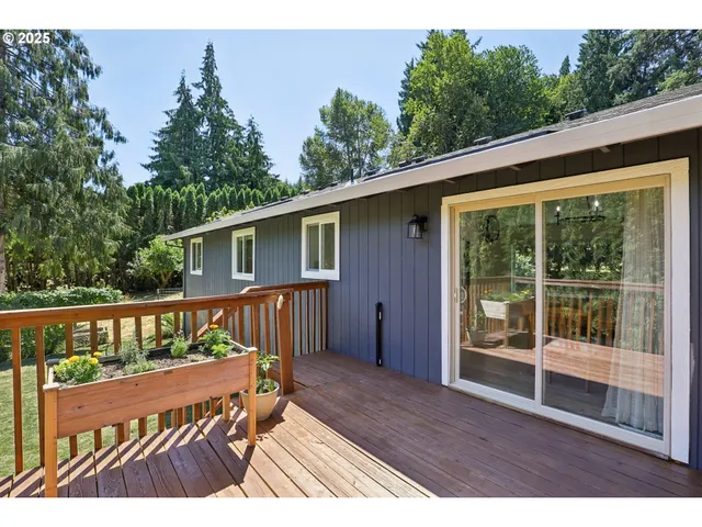 a view of a wooden deck with a bench