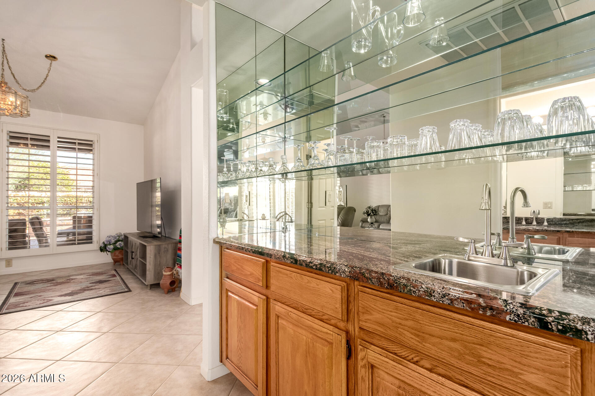 10904 East Spring Creek Road Sun Lakes, AZ 85248 - Photo 11 of 37 a kitchen with a sink and a window