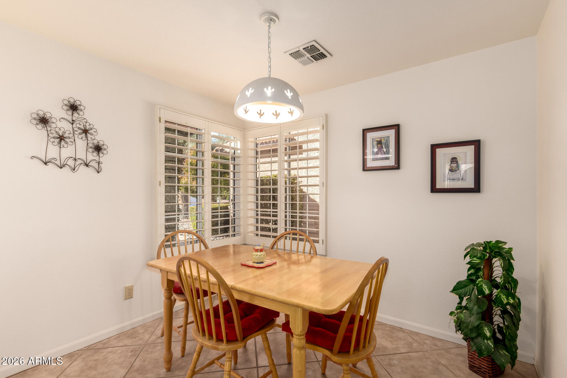 10904 East Spring Creek Road Sun Lakes, AZ 85248 - Photo 14 of 37 a view of a dining room with furniture window and outside view