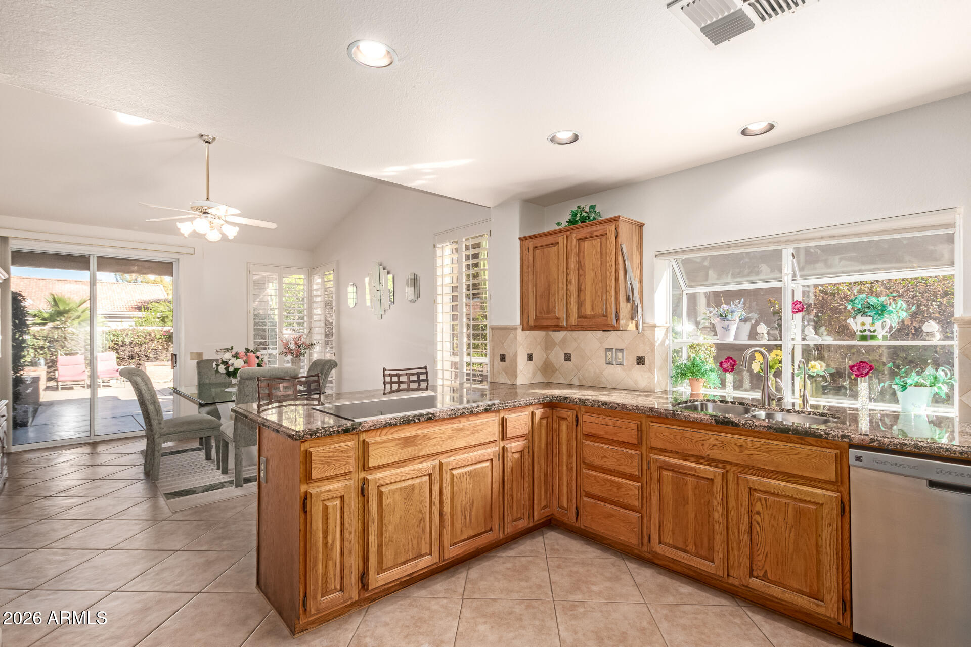 10904 East Spring Creek Road Sun Lakes, AZ 85248 - Photo 18 of 37 a kitchen with a sink and cabinets