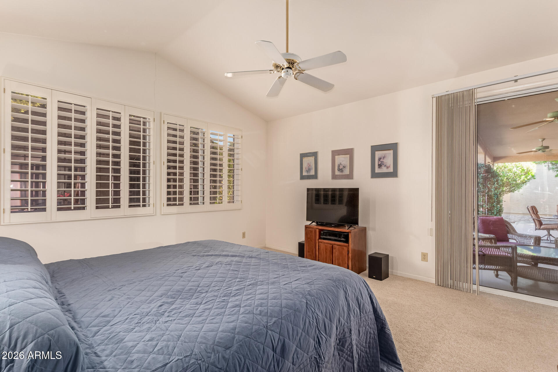 10904 East Spring Creek Road Sun Lakes, AZ 85248 - Photo 21 of 37 a bedroom with a large bed and a window