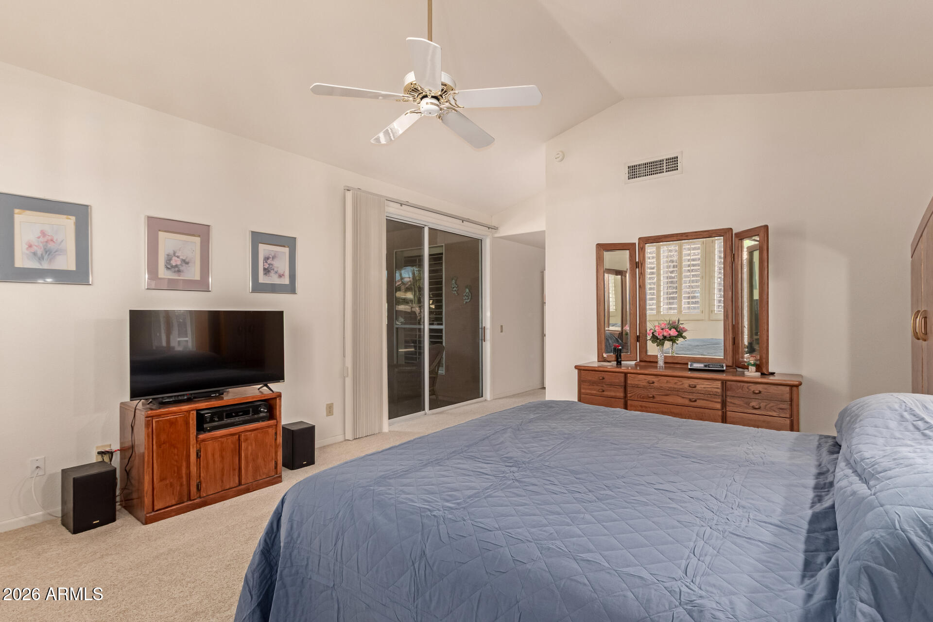 10904 East Spring Creek Road Sun Lakes, AZ 85248 - Photo 22 of 37 a bedroom with a bed and a flat screen tv