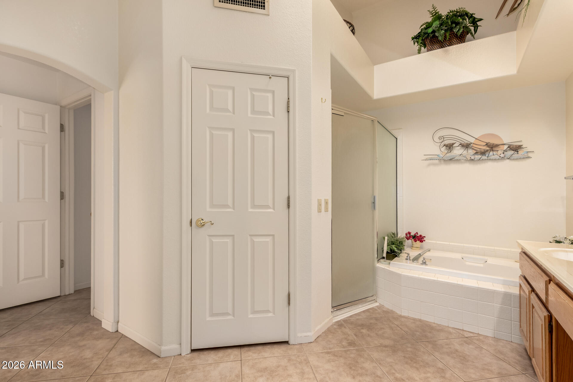 10904 East Spring Creek Road Sun Lakes, AZ 85248 - Photo 25 of 37 a bathroom with a bathtub and a sink