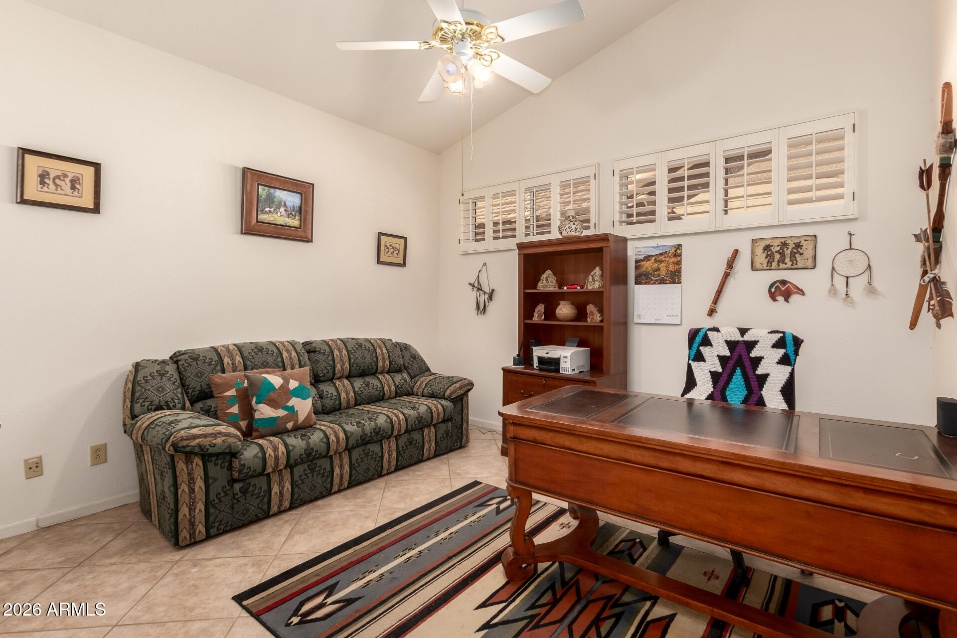 10904 East Spring Creek Road Sun Lakes, AZ 85248 - Photo 29 of 37 a living room with furniture and a bookshelf