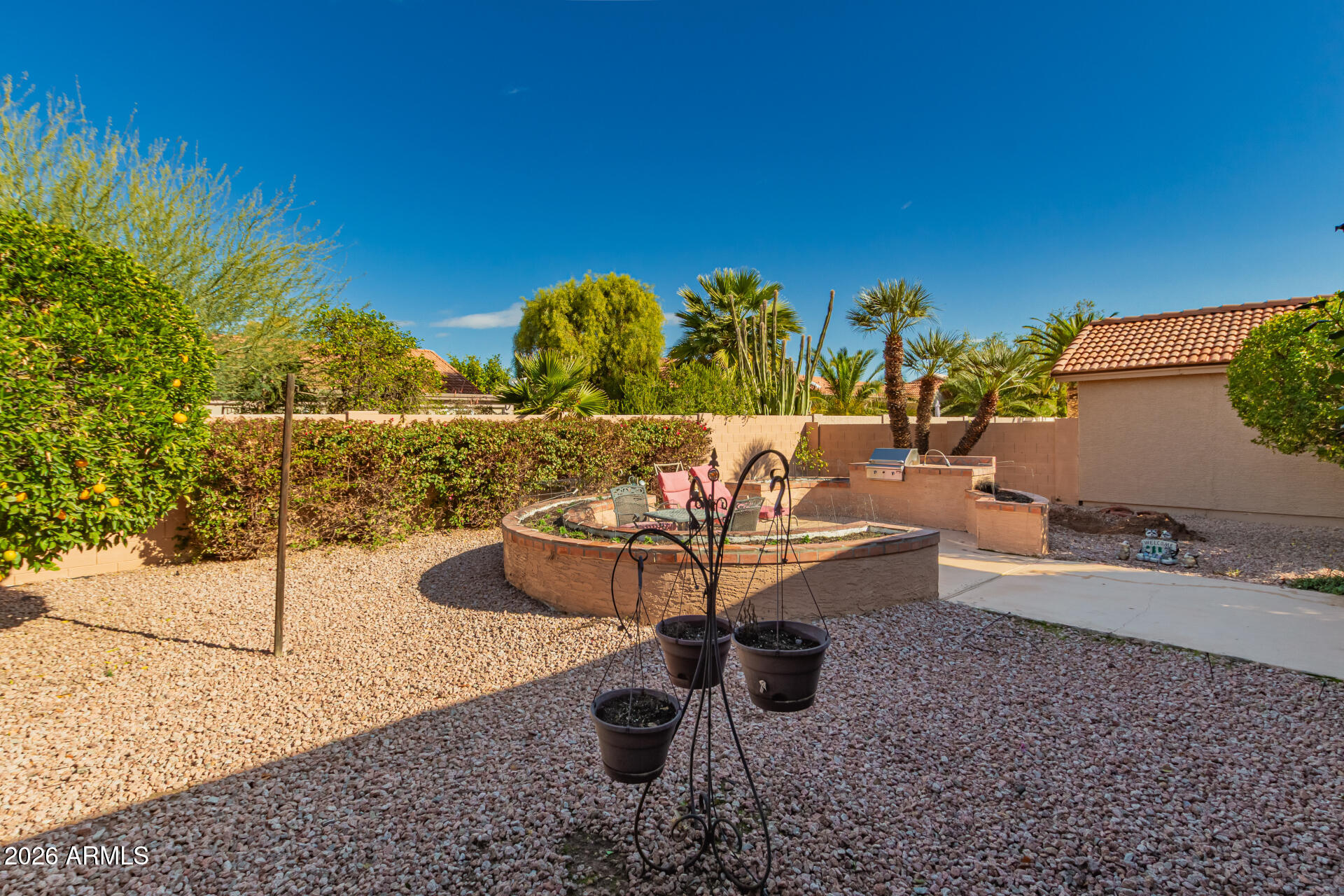 10904 East Spring Creek Road Sun Lakes, AZ 85248 - Photo 36 of 37 a view of a swimming pool with a lounge chair