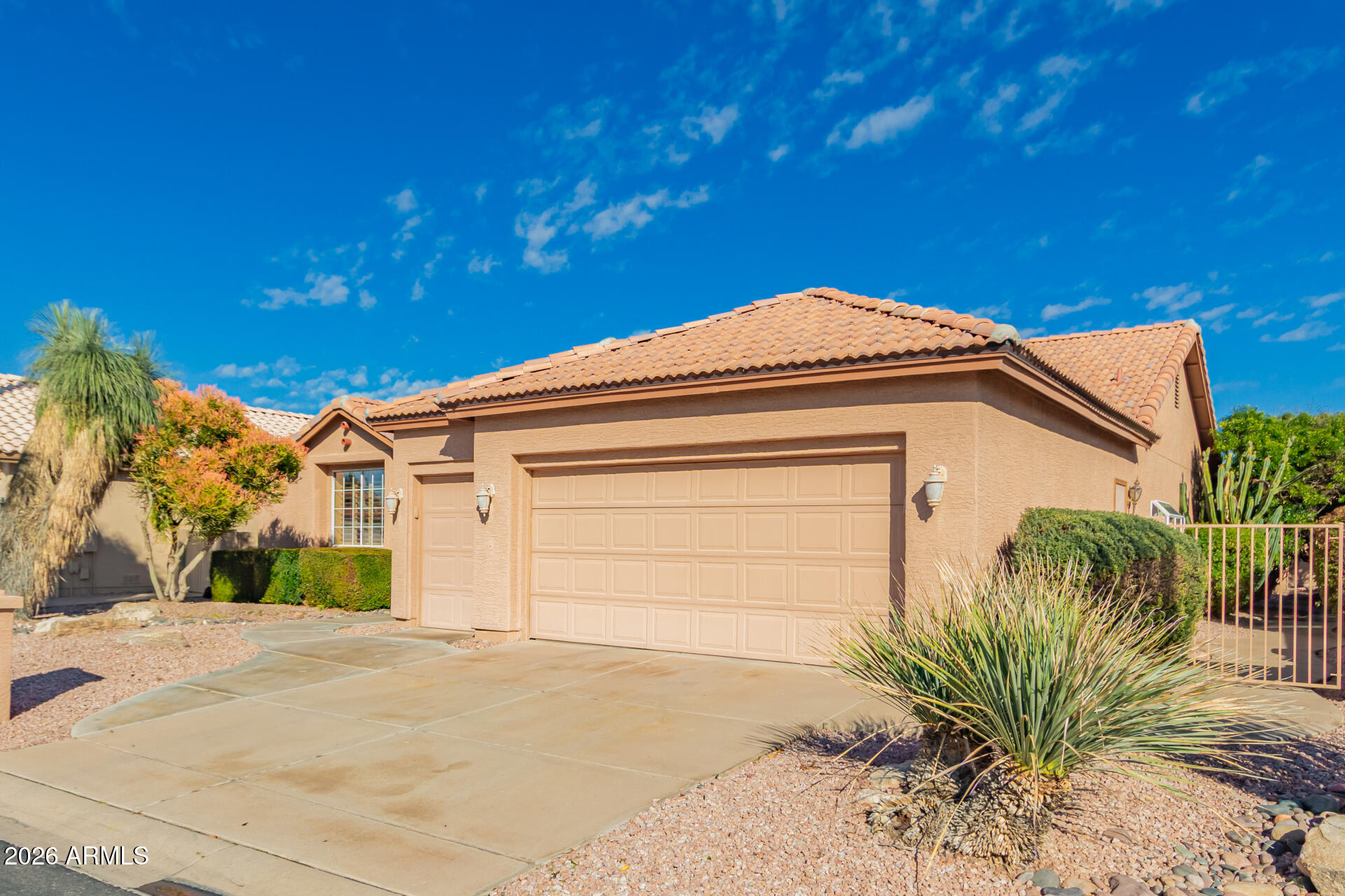 10904 East Spring Creek Road Sun Lakes, AZ 85248 - Photo 4 of 37 a front view of a house with a yard