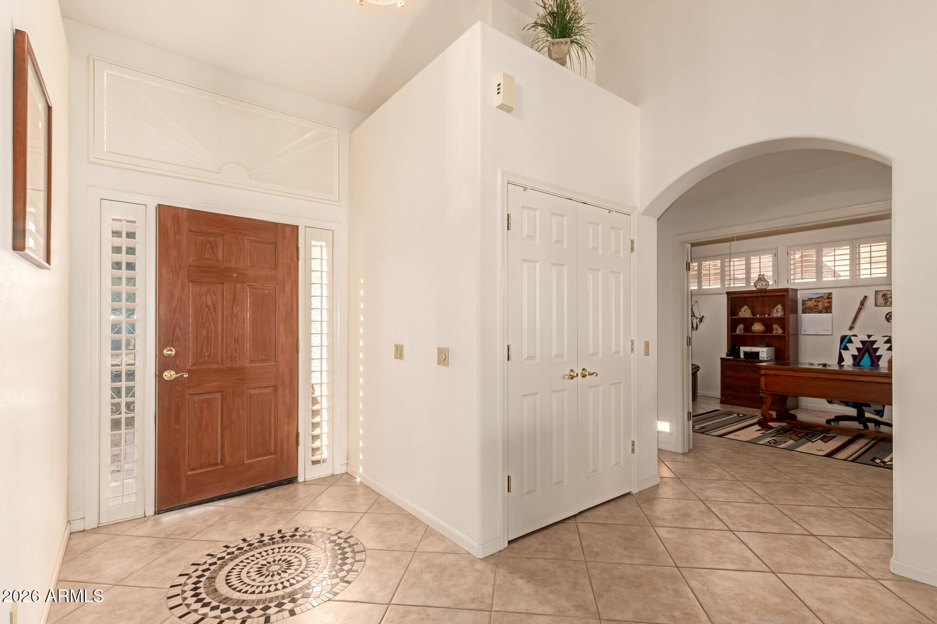 10904 East Spring Creek Road Sun Lakes, AZ 85248 - Photo 6 of 37 a view of a hallway with closet and a potted plant