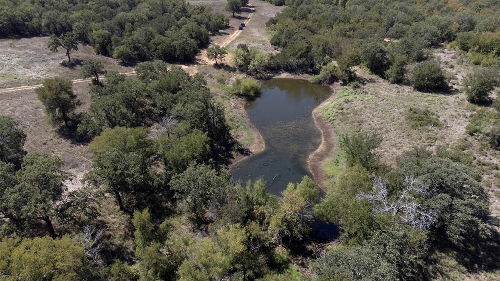 4996 State Highway South Graham, TX 76450 - Photo 7 of 14 Aerial overview of property's location featuring a large body of water and a heavily wooded area