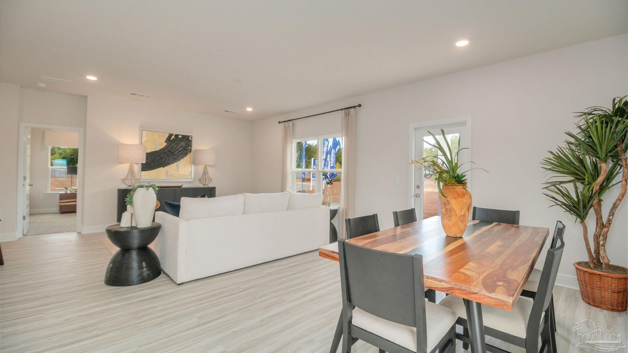 8685 Bluebell Street Milton, FL 32583 - Photo 11 of 30 a living room with furniture and a large window