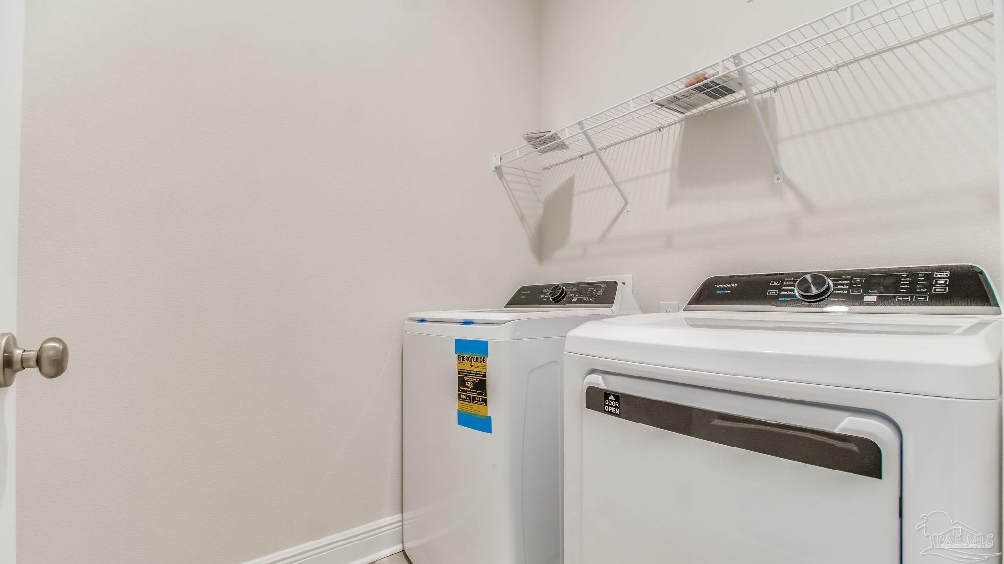 8685 Bluebell Street Milton, FL 32583 - Photo 18 of 30 a utility room with dryer and washer