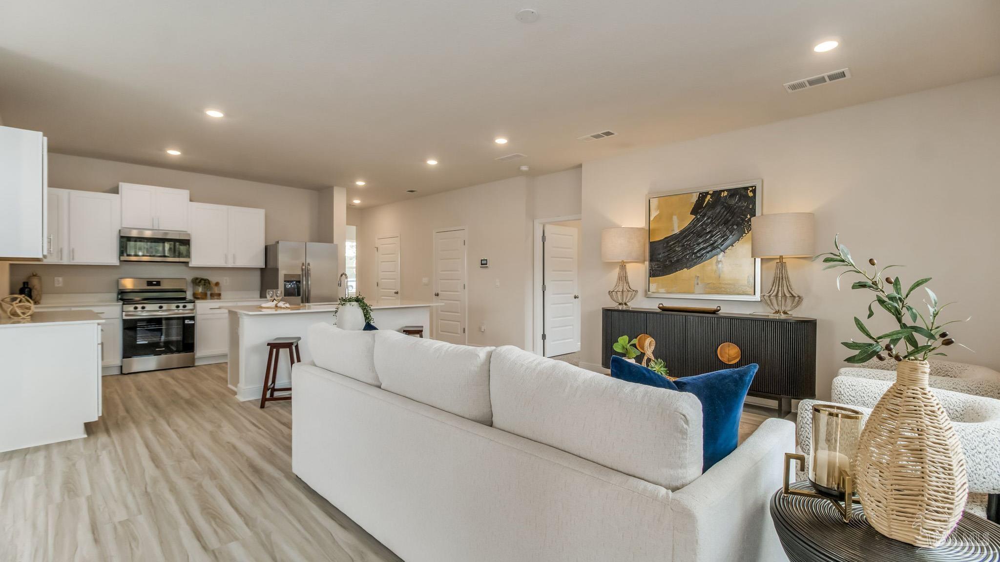 8685 Bluebell Street Milton, FL 32583 - Photo 9 of 30 a living room with furniture and a fireplace
