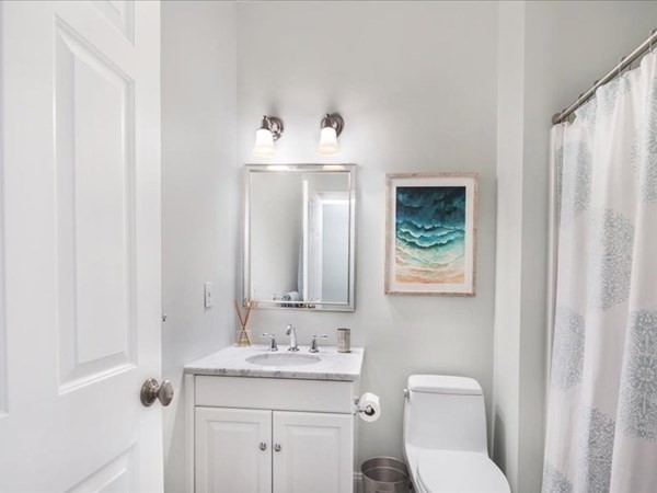 4 Sayles Road Hingham, MA 02043 - Photo 16 of 35 a bathroom with a toilet a sink and mirror