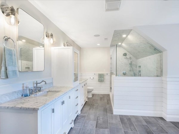 4 Sayles Road Hingham, MA 02043 - Photo 20 of 35 a spacious bathroom with a granite countertop sink mirror and a shower