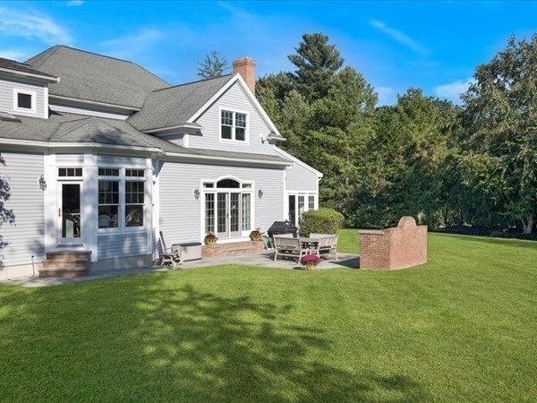 4 Sayles Road Hingham, MA 02043 - Photo 34 of 35 a front view of a house with a garden and chairs