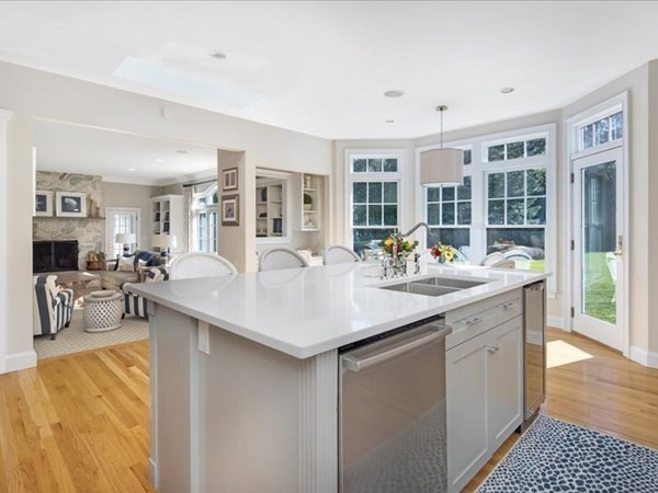 4 Sayles Road Hingham, MA 02043 - Photo 4 of 35 a living room with stainless steel appliances granite countertop a sink and dishwasher with a dining table