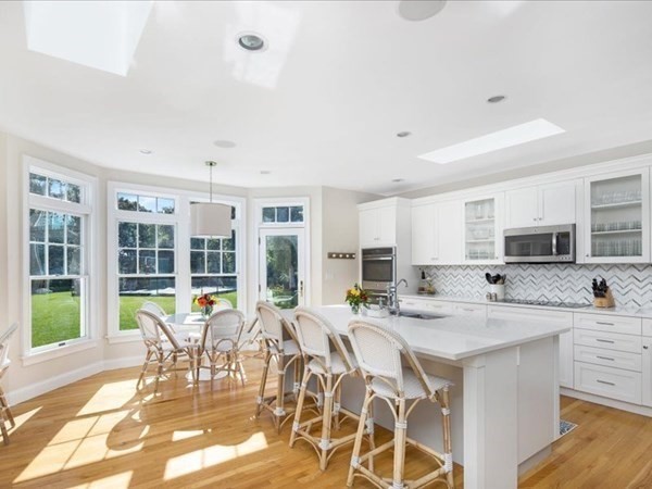 4 Sayles Road Hingham, MA 02043 - Photo 5 of 35 a kitchen with stainless steel appliances kitchen island granite countertop a sink and cabinets