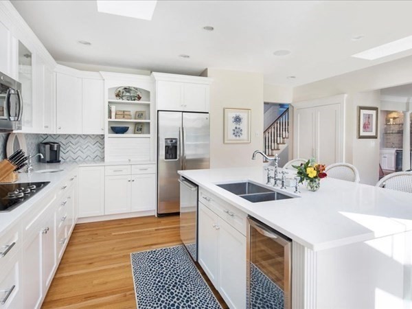 4 Sayles Road Hingham, MA 02043 - Photo 6 of 35 a kitchen with a sink stove and cabinets