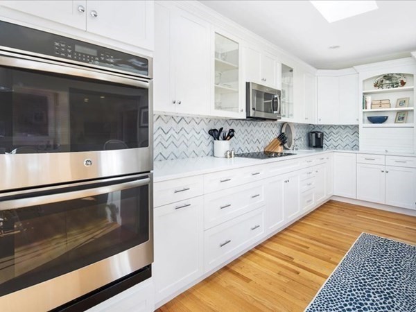 4 Sayles Road Hingham, MA 02043 - Photo 7 of 35 a kitchen with stainless steel appliances a stove microwave and cabinets
