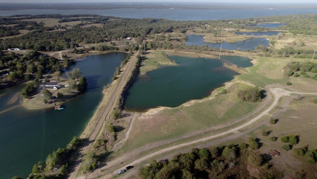 Spring Fed Pond location of custom home site on 3 acres.  (see boundaries in other pictures) New Luxury Development in Quinlan, TX.