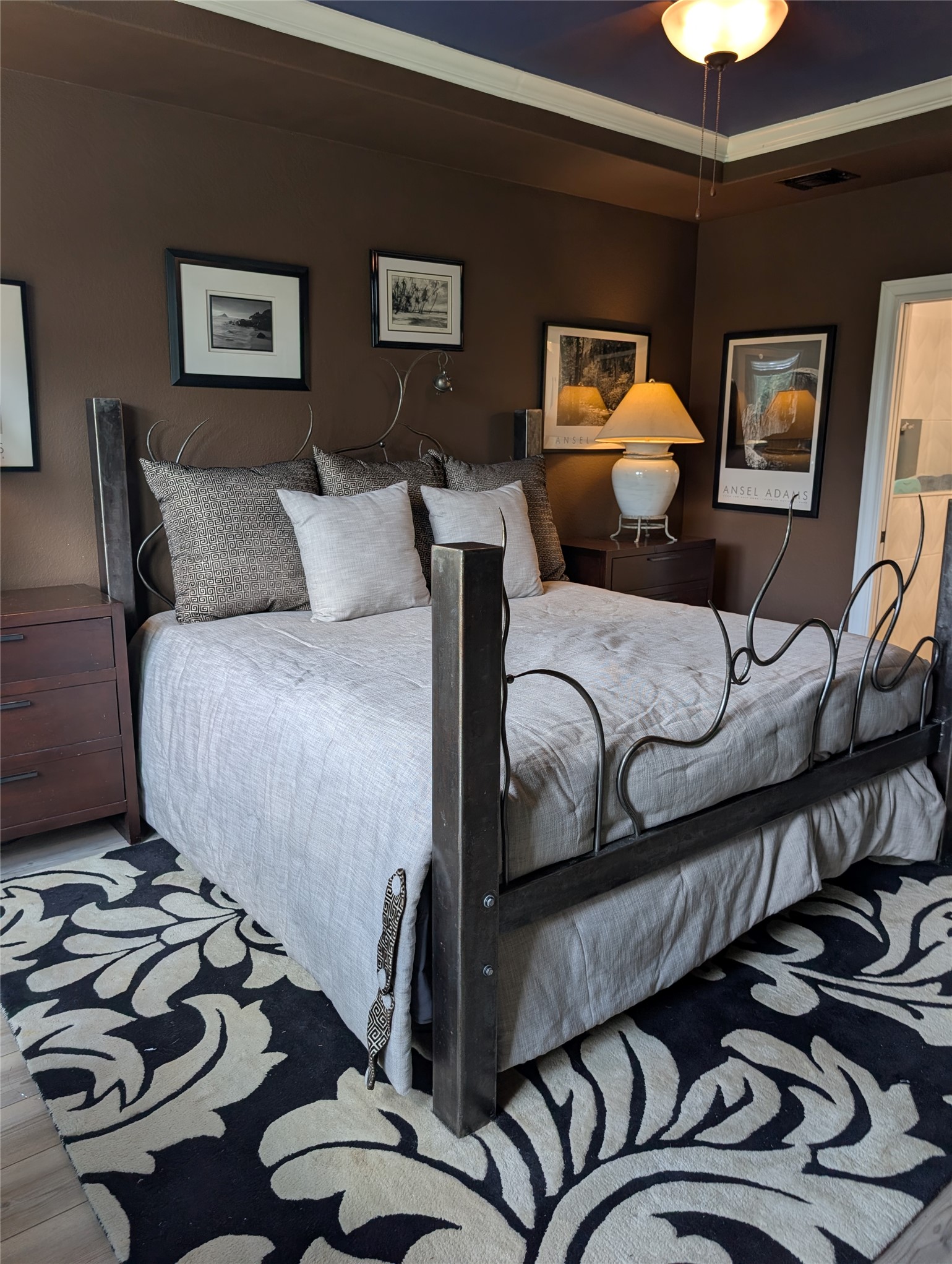 336 Kitty Hawk Road Georgetown, TX 78633 - Photo 22 of 40 Richly toned walls and a classic tray ceiling define this elegant private bedroom retreat.