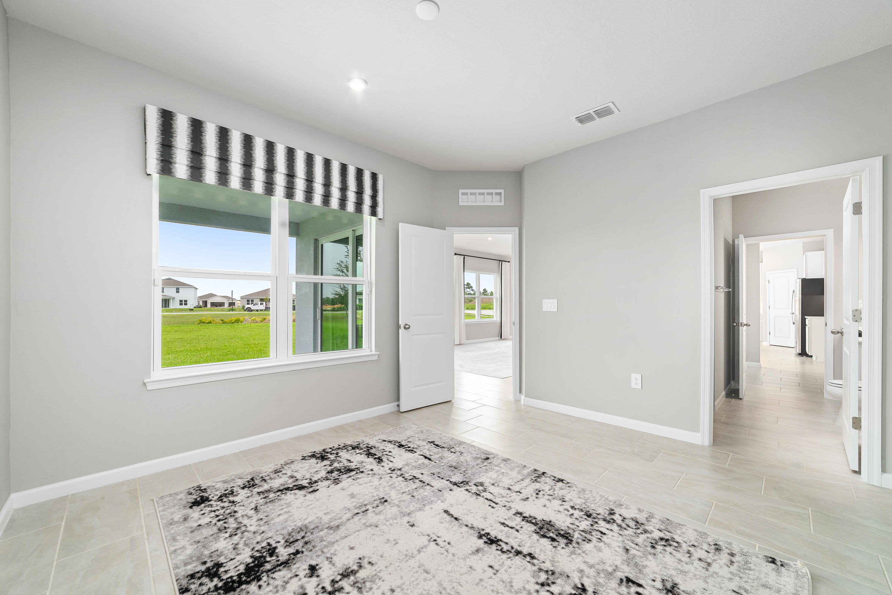 6555 Pomello Court Vero Beach, FL 32967 - Photo 13 of 35 a view of a hallway with a window