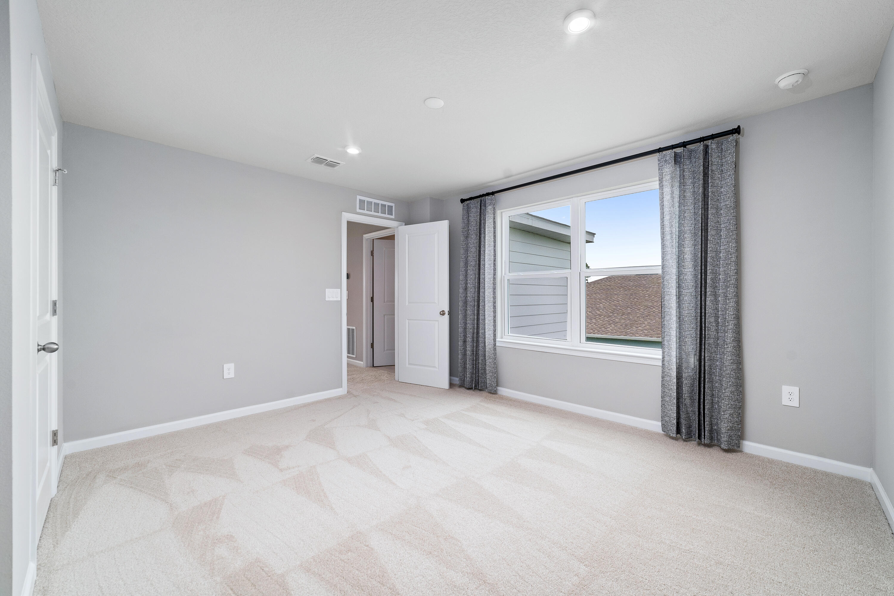 6555 Pomello Court Vero Beach, FL 32967 - Photo 23 of 35 a view of an empty room with a window