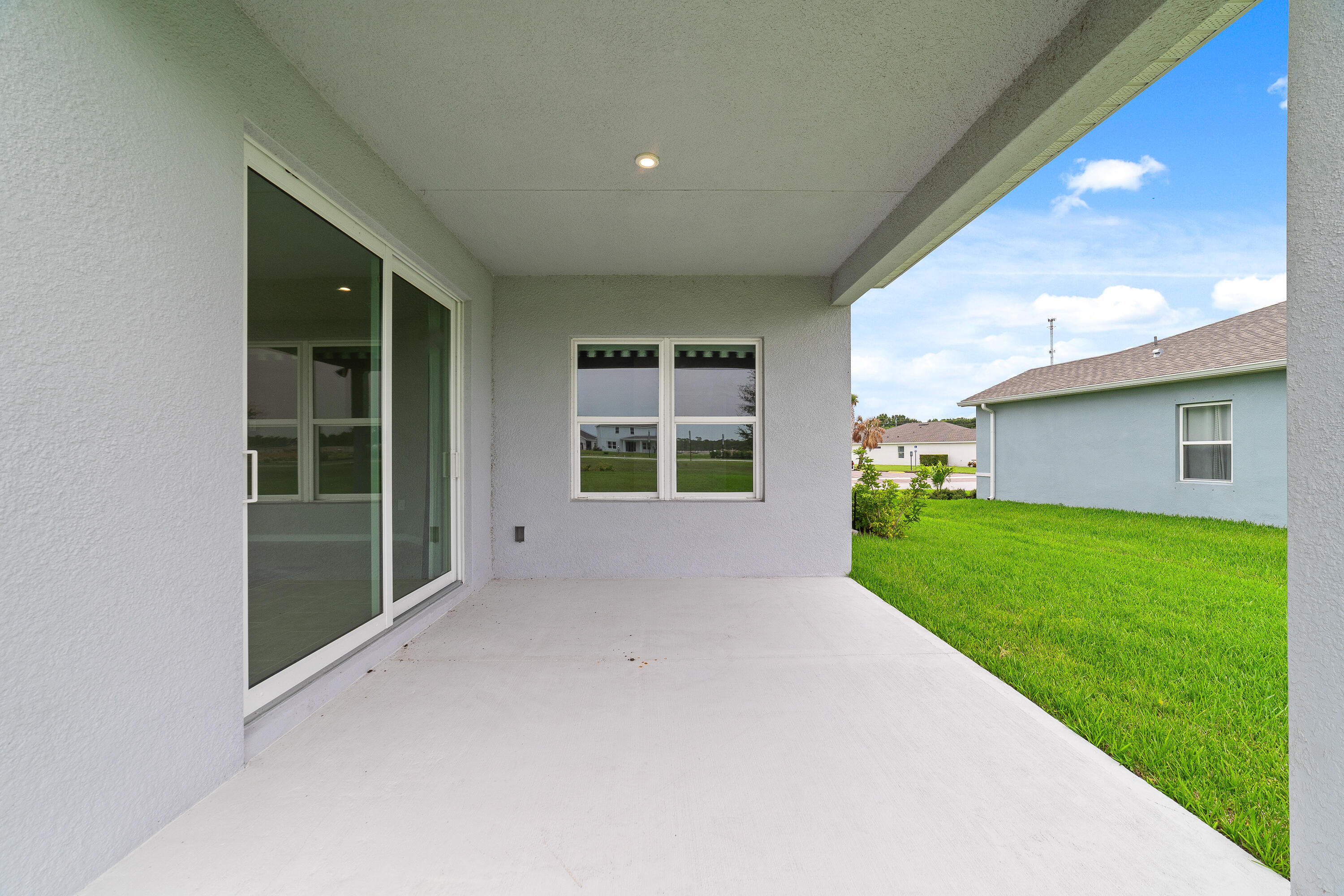 6555 Pomello Court Vero Beach, FL 32967 - Photo 30 of 35 a view of a house with a backyard