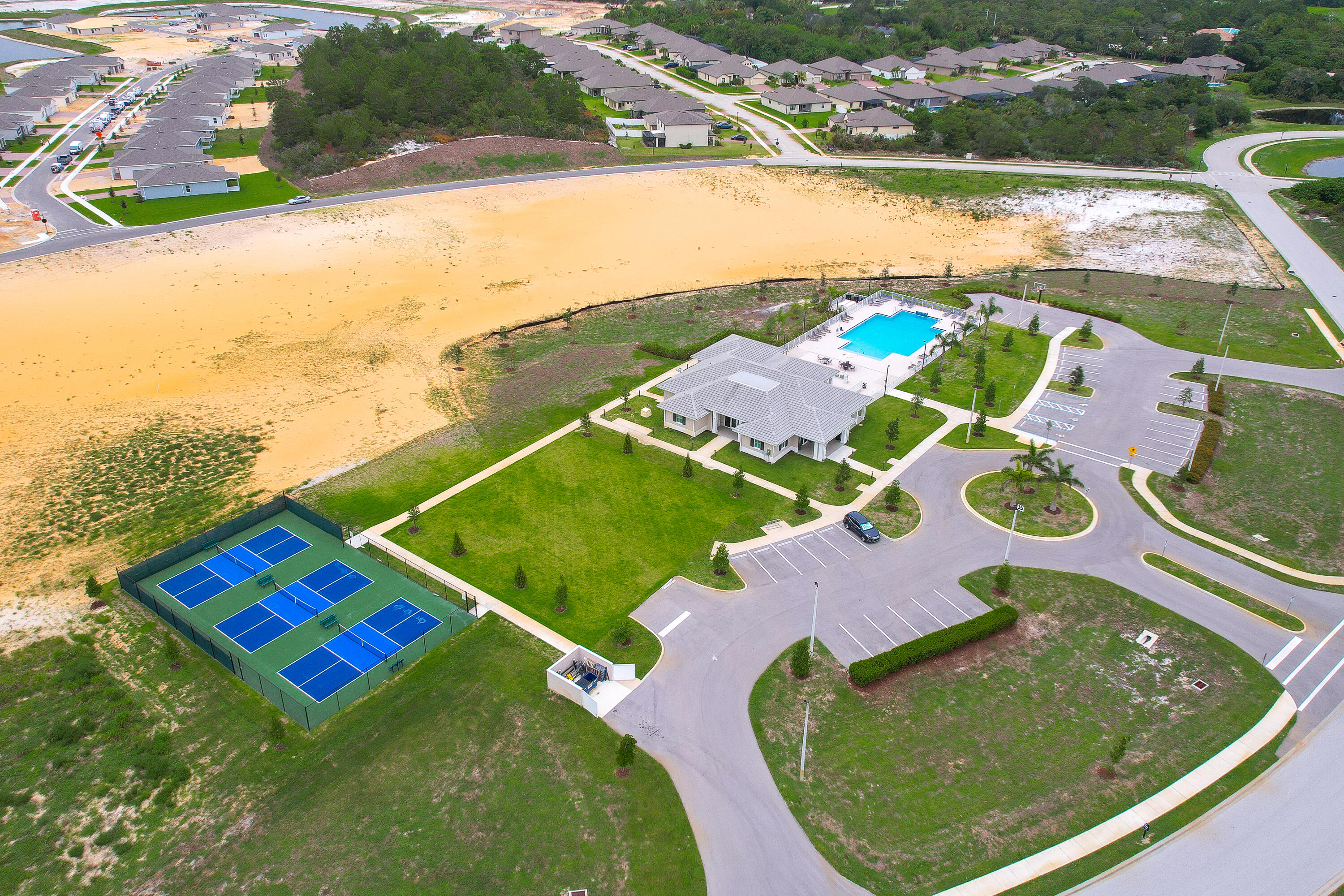 6555 Pomello Court Vero Beach, FL 32967 - Photo 34 of 35 an aerial view of a pool patio lake and outdoor seating