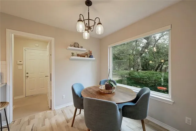 a view of a dining room with furniture window and outside view