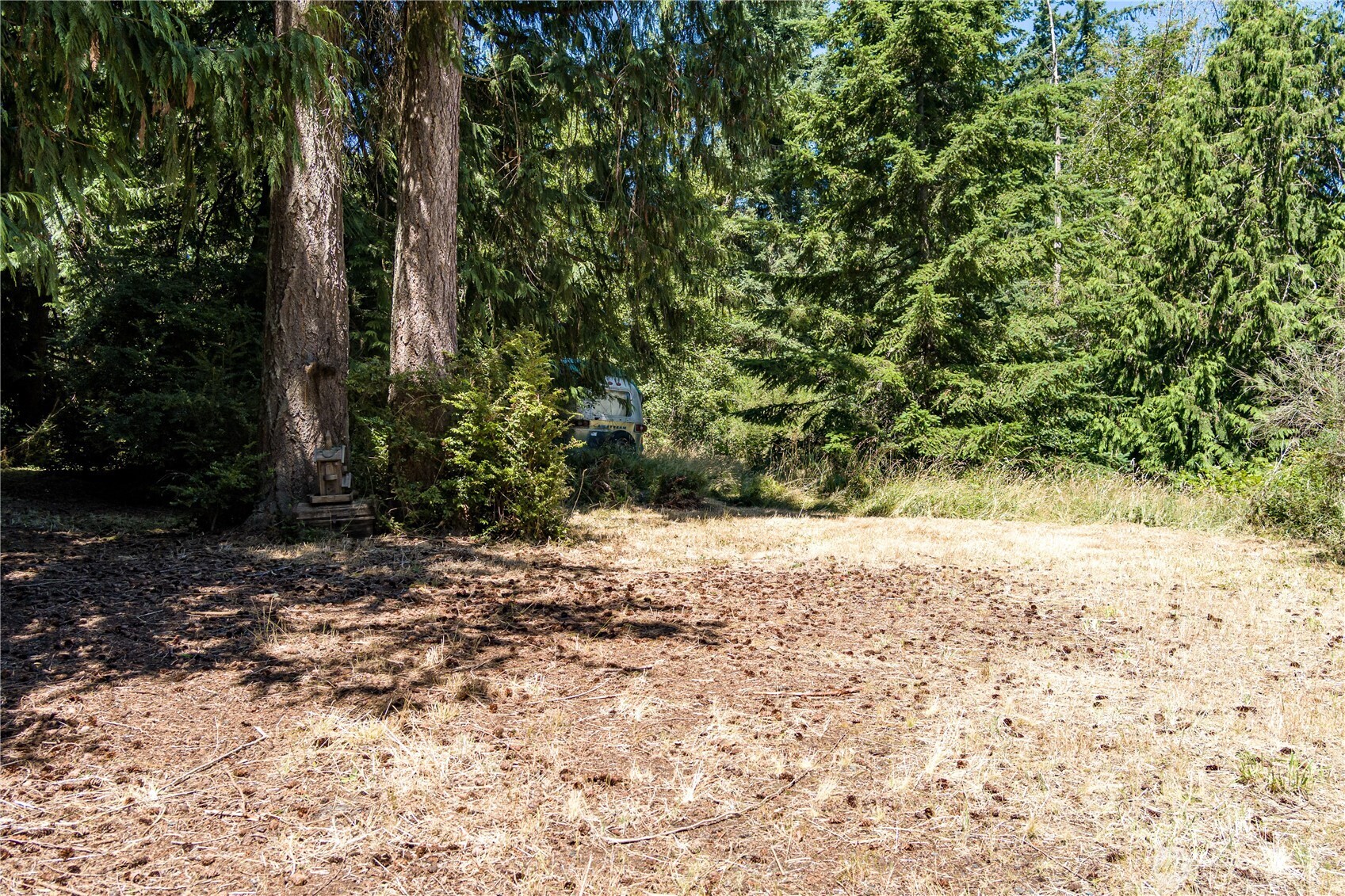 -xxx Sandy Point Road Langley, WA 98260 - Photo 4 of 17 a wooden bench with view of trees