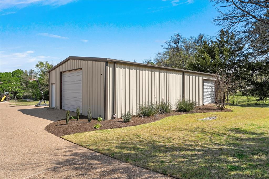 14690 Chapel Road Lorena, TX 76655 - Photo 36 of 40 a view of a house with backyard and trees